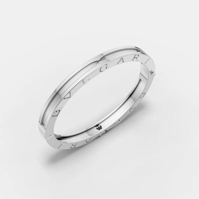 Silver bracelet with brand name on a light gray background
