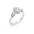 Oval Cut Diamond Three Stone Engagement Ring with Pear Side Diamonds
