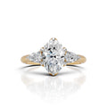 Oval Cut Diamond Three Stone Engagement Ring with Pear Side Diamonds